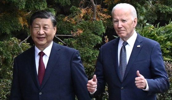 Chinese President Xi Jinping and U.S. President Joe Biden walk together after a meeting during the Asia-Pacific Economic Cooperation Leaders' week in Woodside, California on Nov. 15.