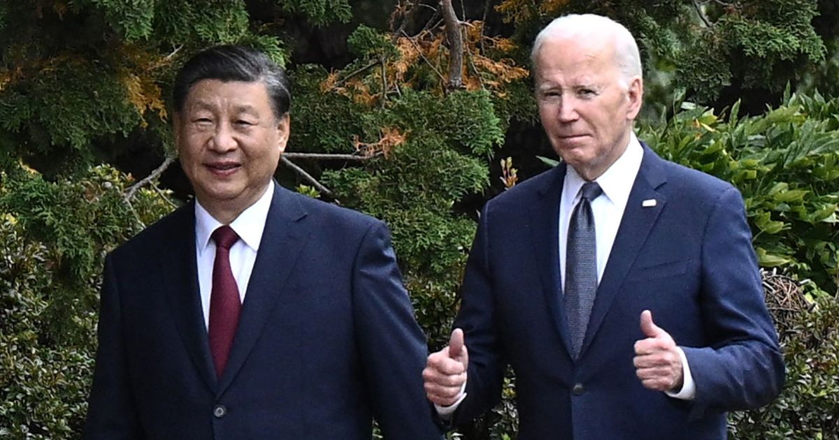 Chinese President Xi Jinping and U.S. President Joe Biden walk together after a meeting during the Asia-Pacific Economic Cooperation Leaders' week in Woodside, California on Nov. 15.