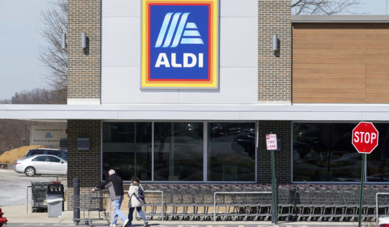 Customers walk into an Aldi supermarket in Bensalem, Pennsylvania, on March 14, 2022.
