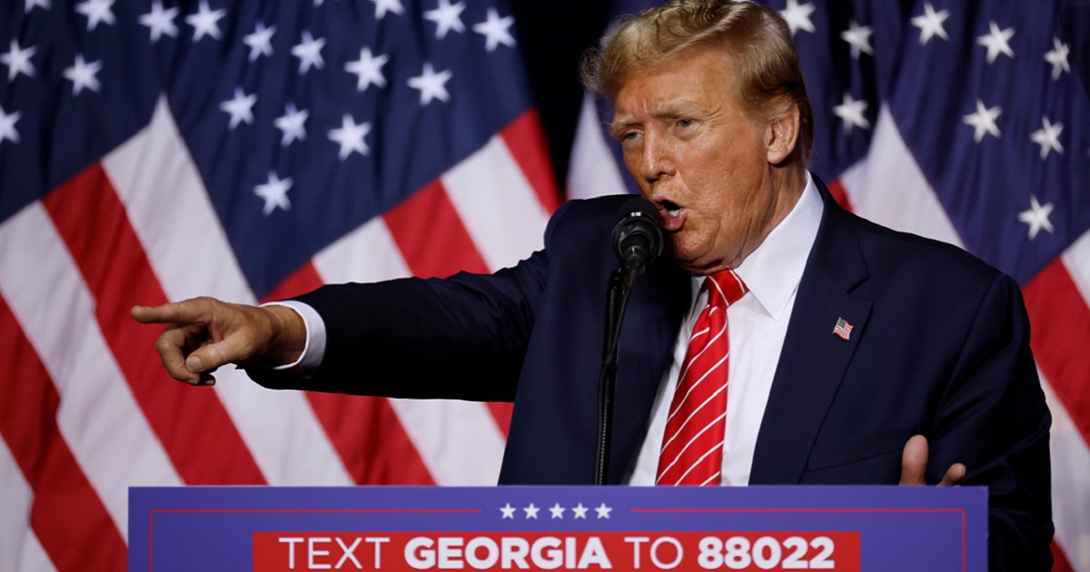 Former President Donald Trump, points to the crowd during a campaign rally in Rome, Georgia, on Saturday.