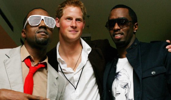 Britain's Prince Harry, center, with entertainers Kanye West, left, and Sean “Diddy” Combs, right, in a 2007 photo.