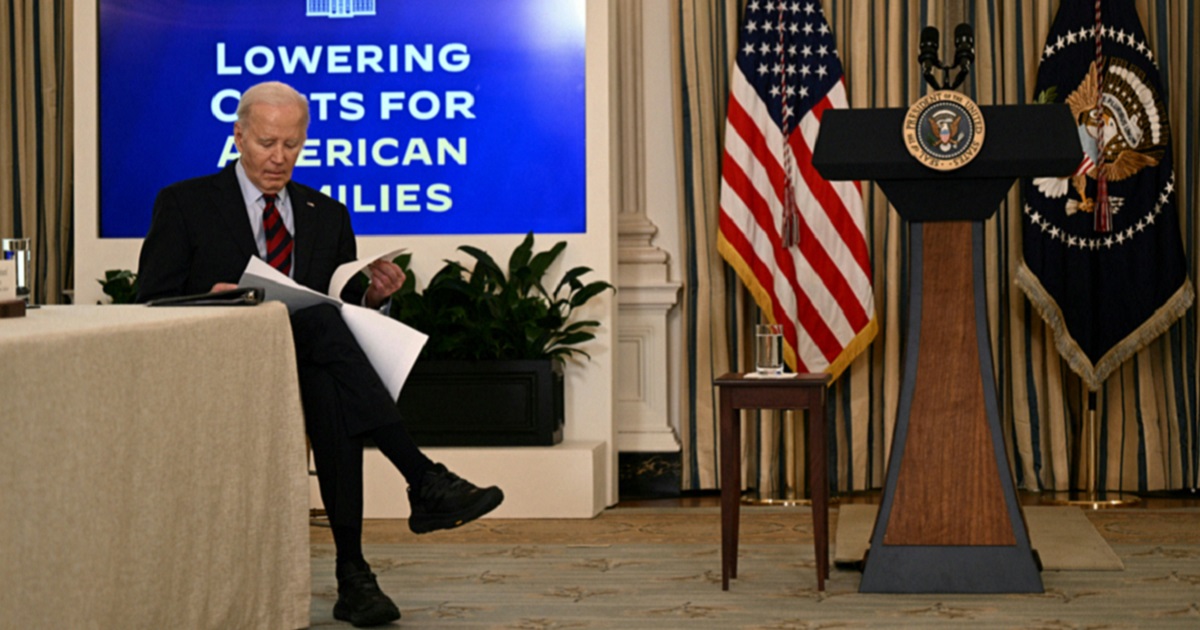 President Joe Biden, with his shoes featured prominently, is pictured in a March 5 photo from the White House.