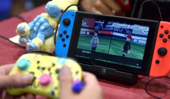 A competitor plays Pokemon on a Nintendo Switch console during the 2022 Pokémon World Championships at ExCel on August 18, 2022 in London, England.