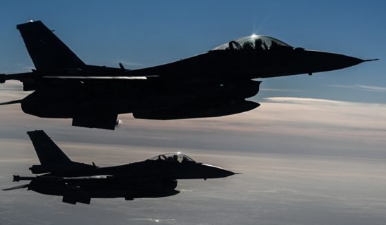 Airborne Polish Air Force F-16s are pictured in an October 2022 file photo from NATO exercises in Lask, Poland.
