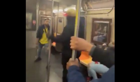 An attacker and victim square off in a subway fight Thursday in Brooklyn.