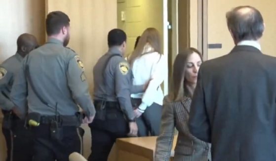 Former ESPN host Michelle Troconis is escorted from the courtroom Friday after being convicted in the murder of a woman in New Canaan, Connecticut, in 2019.