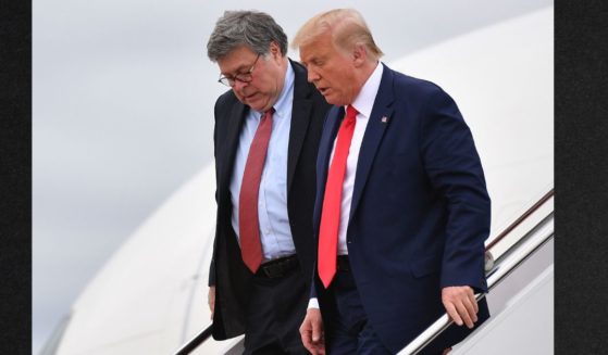Then-President Donald Trump, right, and U.S. Attorney General William Barr are seen stepping off Air Force One upon arrival at Andrews Air Force Base in Maryland on September 1, 2020.