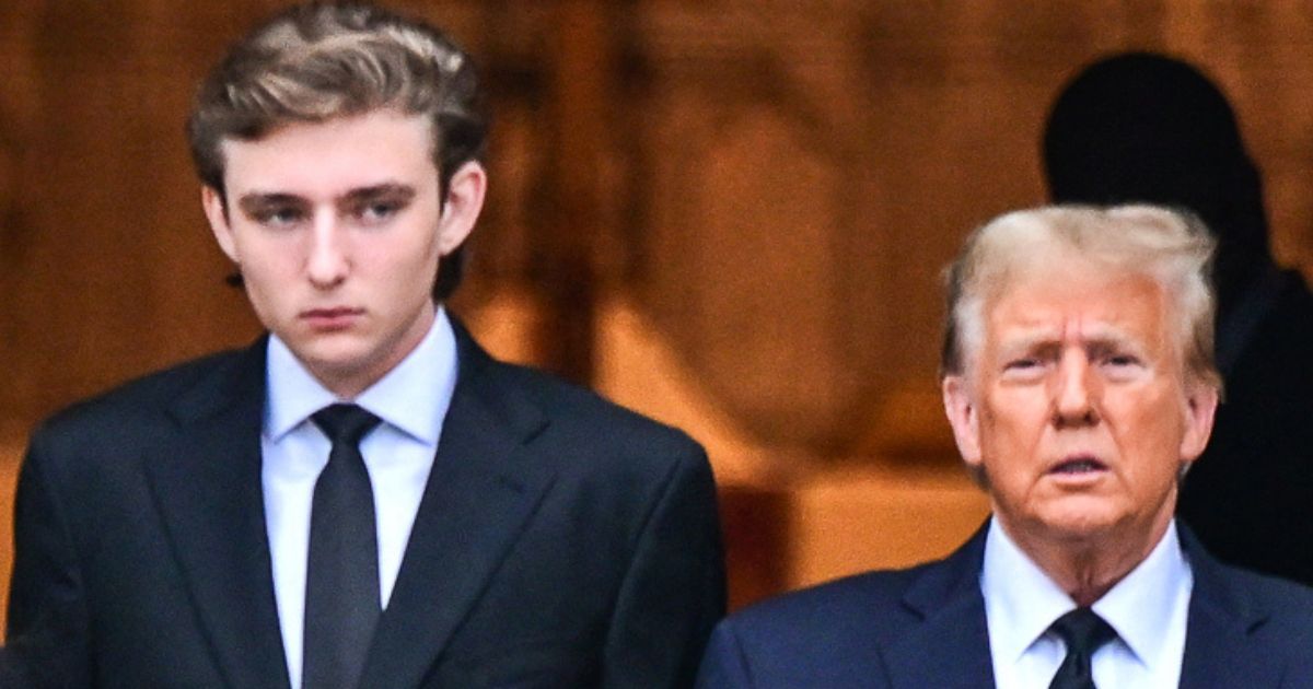 Former President Donald Trump, right, and his son Barron Trump, left, attend the funeral for the former first lady's mother at the Church of Bethesda-by-the-Sea, in Palm Beach, Florida, on Jan. 18.