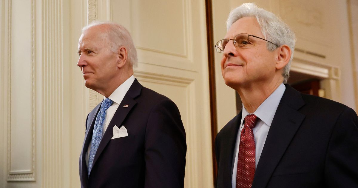 President Joe Biden, left, and Attorney General Merrick Garland walk into the East Room at the White House in Washington on May 16, 2022.