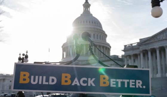 With the U.S. Capitol dome in the background, a sign that reads "Build Back Better" is displayed in Washington, D.C.