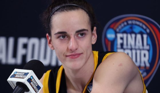Caitlin Clark of the Iowa Hawkeyes talks with the media after losing to the South Carolina Gamecocks in the 2024 NCAA Women's Basketball Tournament National Championship in Cleveland, Ohio, on Sunday.