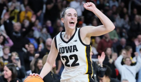 Caitlin Clark, of the Iowa Hawkeyes, celebrates after beating the LSU Tigers 94-87 in the Elite 8 round of the NCAA Women's Basketball Tournament at MVP Arena Monday in Albany, New York.