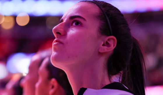 Caitlin Clark of the Iowa Hawkeyes looks on during the National Anthem before playing the South Carolina Gamecocks in the 2024 NCAA Women's Basketball Tournament National Championship in Cleveland, Ohio, on April 7.