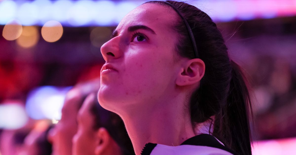 Caitlin Clark of the Iowa Hawkeyes looks on during the National Anthem before playing the South Carolina Gamecocks in the 2024 NCAA Women's Basketball Tournament National Championship in Cleveland, Ohio, on April 7.