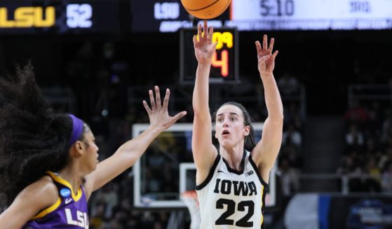 Caitlin Clark of the Iowa Hawkeyes shoots a 3-pointer in front of Angel Reese of the LSU Tigers during the second half of their NCAA Tournament game at MVP Arena in Albany, New York, on Monday.