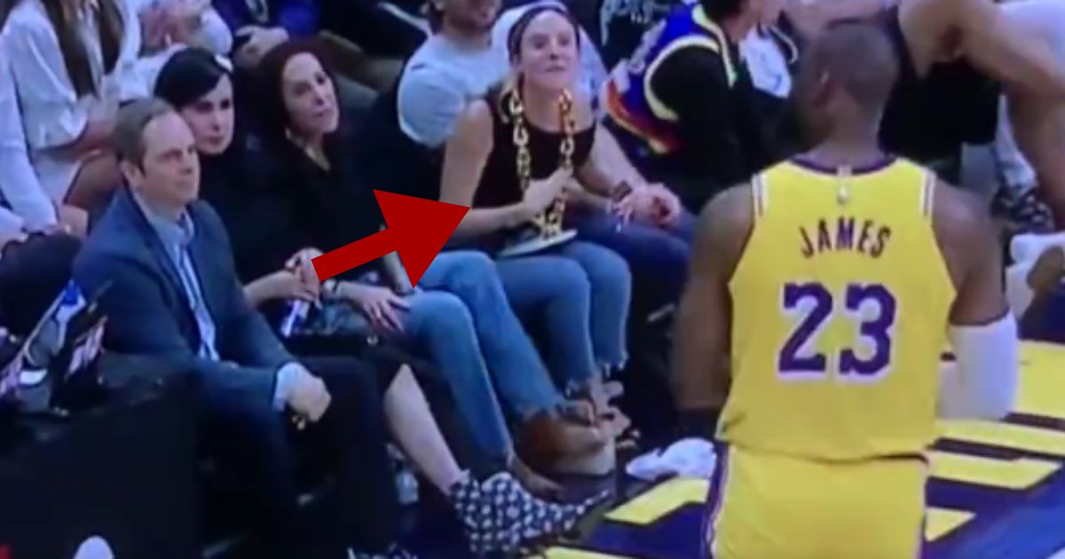 During the Los Angeles Lakers' loss to the Denver Nuggets on Monday, LeBron James, right, had a fit on the court and seemingly tried to jump scare a fan, center, that called him a "cry baby."