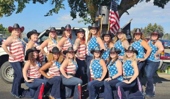 Members of the Borderline Dance Team are shown wearing American flag-themed shirts.
