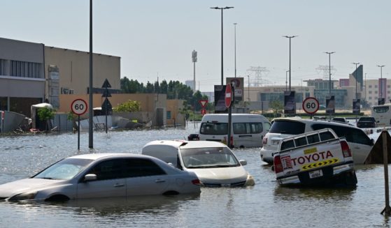 Cars are stranded on a flooded street in Dubai following heavy rains on Friday.