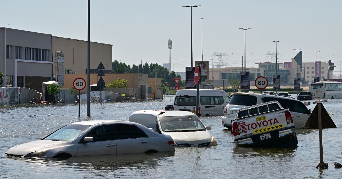 Cars are stranded on a flooded street in Dubai following heavy rains on Friday.