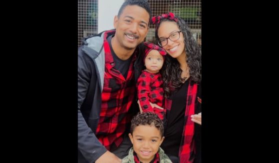New York firefighter Derek Floyd is seen with his wife, Cristine, and two children.