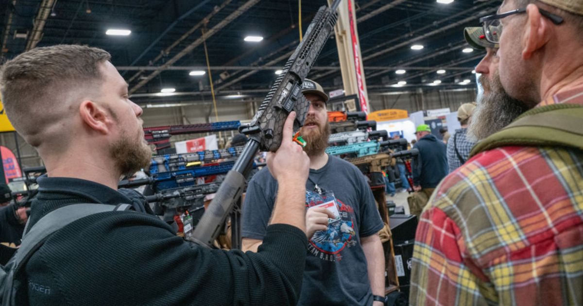 People look at guns and ammunition at the Great American Outdoor Show on Feb. 9 in Harrisburg, Pennsylvania.