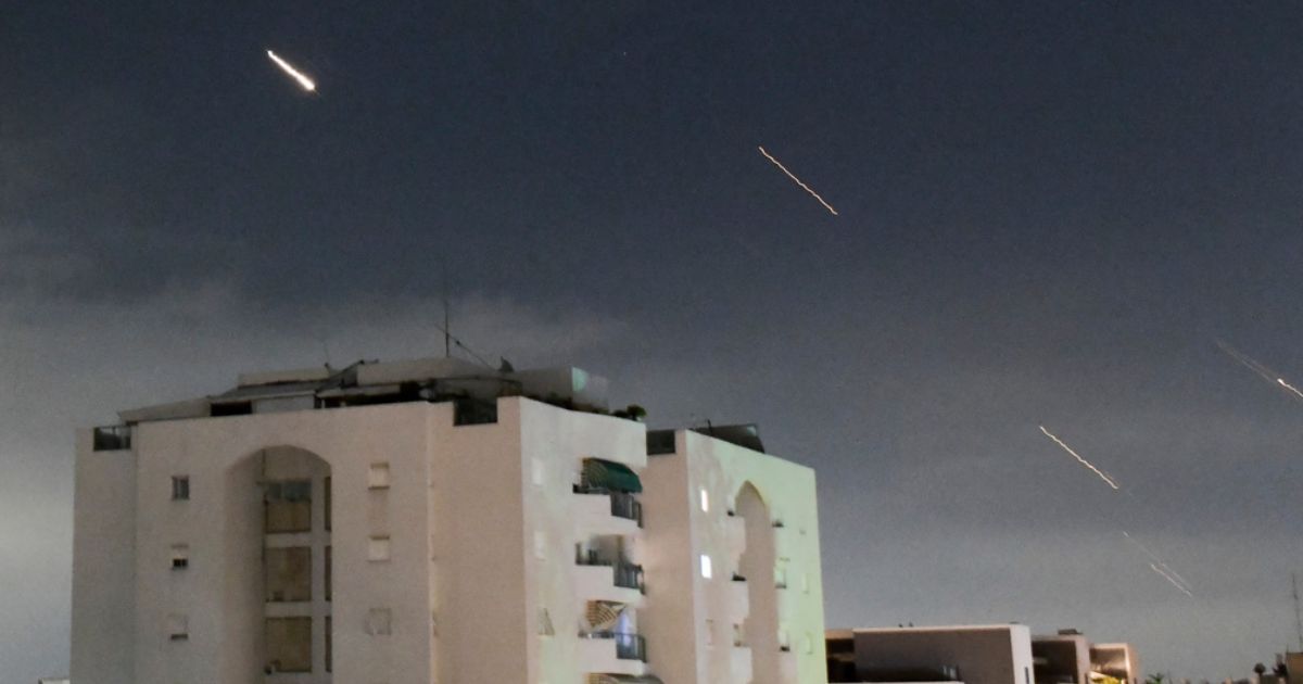 Israeli Iron Dome air defense system launches to intercept missiles fired from Iran, in central Israel, Sunday. Iran launched its first direct military attack against Israel on Saturday.