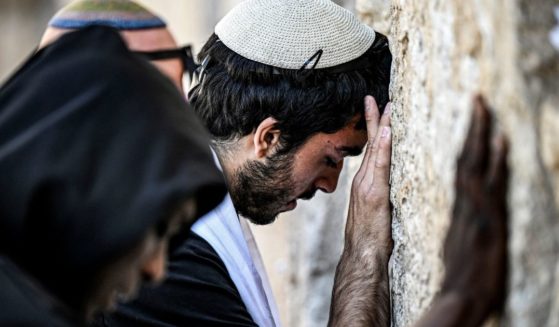 People pray at the Western Wall, the holiest site where Jews are allowed to worship, in the old city of Jerusalem on April 16.