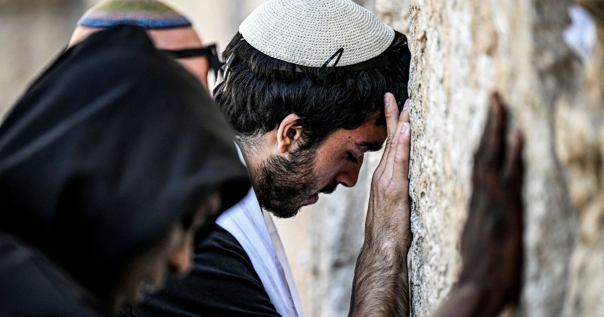 People pray at the Western Wall, the holiest site where Jews are allowed to worship, in the old city of Jerusalem on April 16.