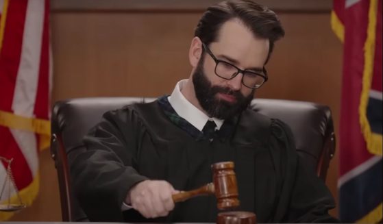 Matt Walsh holding a gavel in an episode of the Daily Wire's new show "Judged By Matt Walsh."