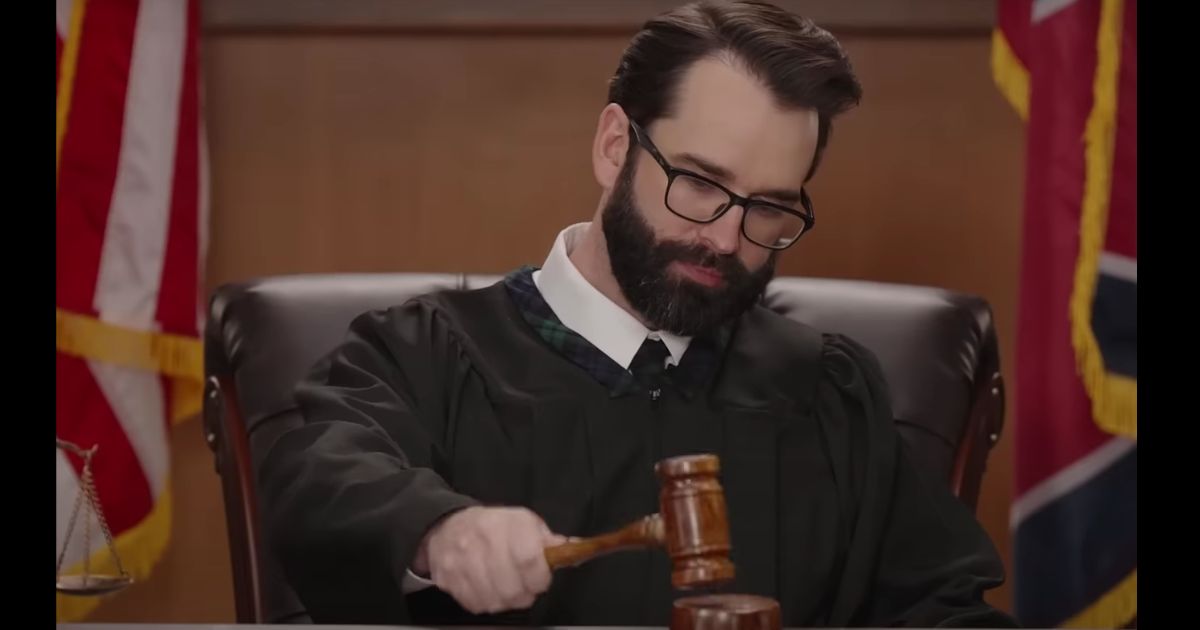 Matt Walsh holding a gavel in an episode of the Daily Wire's new show "Judged By Matt Walsh."