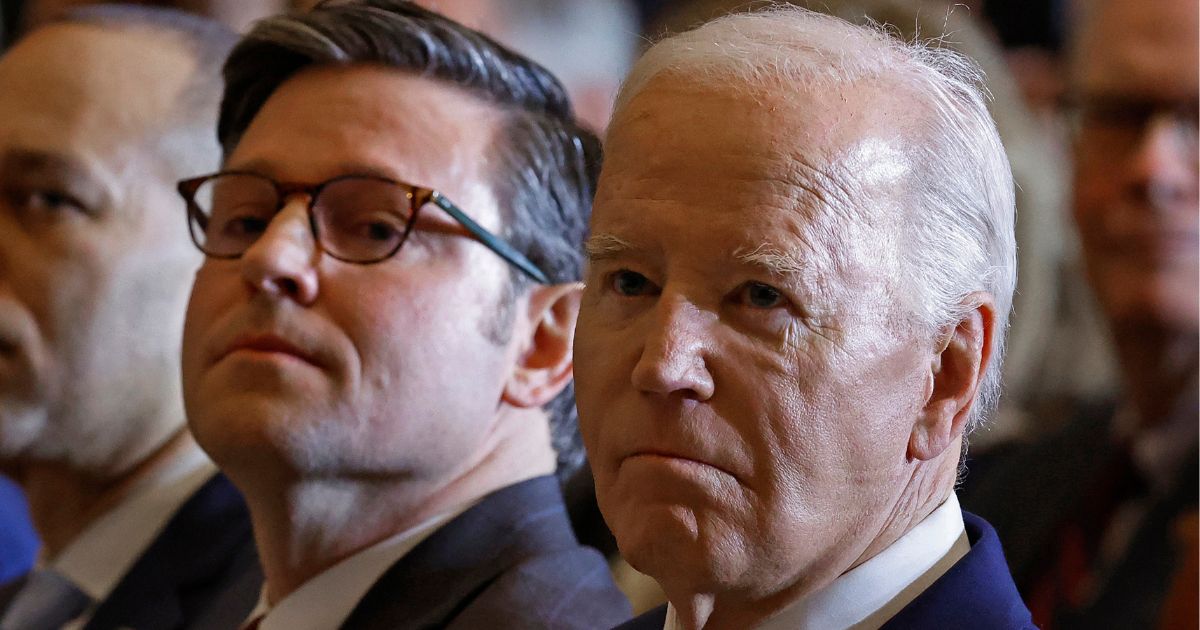 Speaker of the House Mike Johnson, left, and President Joe Biden, right, attend the annual National Prayer Breakfast in the U.S. Capitol in Washington, D.C., on Feb. 1.