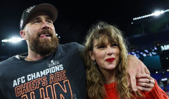 Travis Kelce, of the Kansas City Chiefs, (L) celebrates with Taylor Swift after defeating the Baltimore Ravens in the AFC Championship Game at M&T Bank Stadium on Jan. 28 in Baltimore, Maryland.