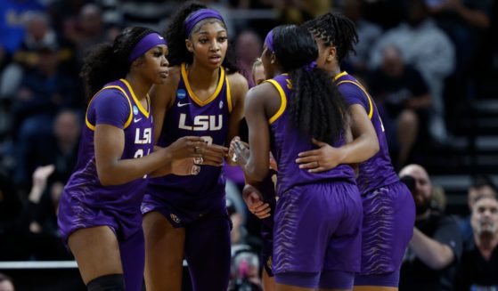 The LSU Tigers huddle during the first half against the Iowa Hawkeyes in the Elite 8 round of the NCAA Women's Basketball Tournament in Albany, New York, on Monday.