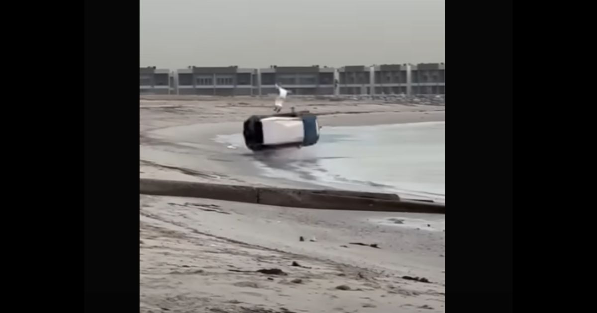 An image from video shows the moment a 4WD loses control and rolls multiple times on Abu Al Hasaniya Beach in Kuwait, with the vehicle's 34-year-old driver miraculously walking away from the wreckage with minor injuries.