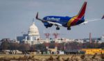 A Southwest Airlines plane is seen in a file photo from November 2021 lands at Ronald Reagan Washington National Airport, where two planes nearly collided this week.
