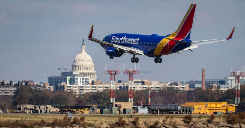 A Southwest Airlines plane is seen in a file photo from November 2021 lands at Ronald Reagan Washington National Airport, where two planes nearly collided this week.