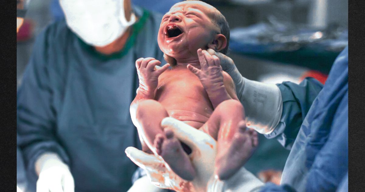 This stock image depicts a newborn baby.