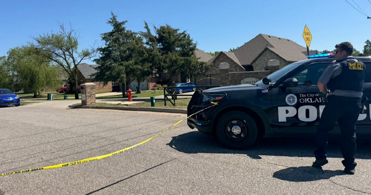 Oklahoma City police at the scene of a home where the bodies of five, including two children, were found Monday morning.