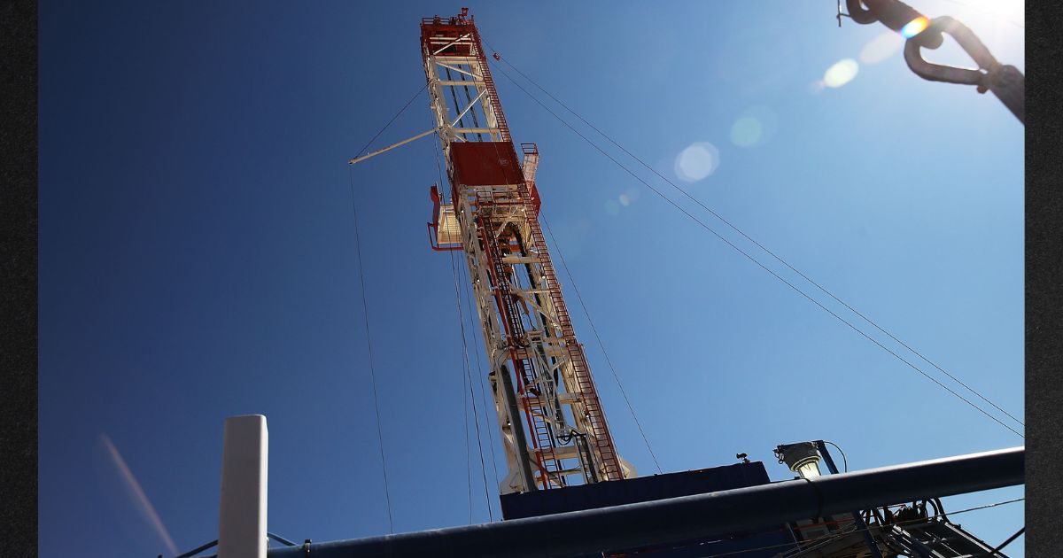 An oil drilling rig drills in Texas in this file photo from 2015.