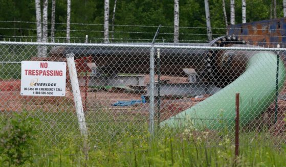In this file photo from June 29, 2018, a No Trespassing sign is visible at a Enbridge Energy pipeline drilling pad in Minnesota. After President Joe Biden revoked Keystone XL's presidential permit and shut down construction of the long-disputed pipeline that was to carry oil from Canada to Texas, opponents of other pipelines hoped the projects they've been fighting would be next.