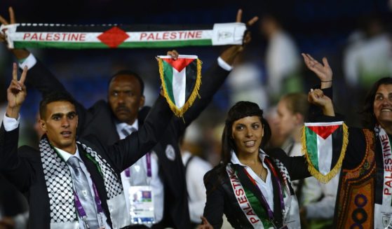 Members of the Palestinian delegation parade during the opening ceremony of the Summer Games at the Olympic Stadium in London on July 27, 2012.
