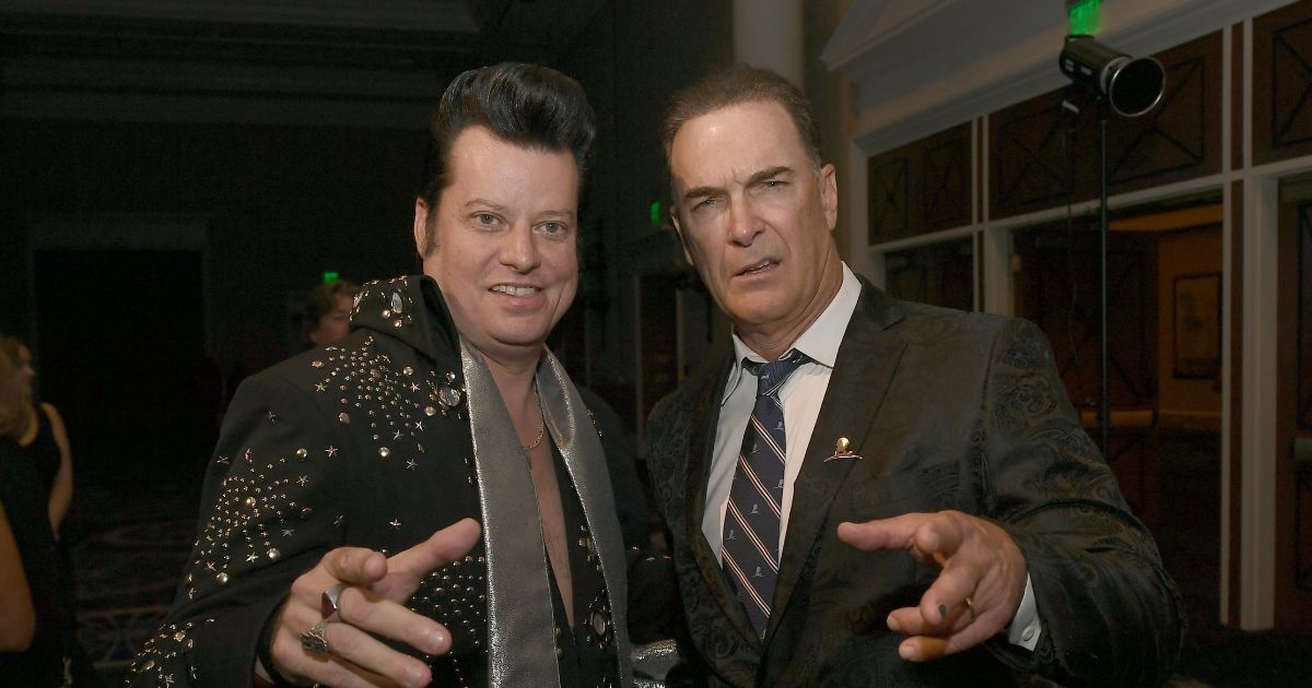Elvis impersonator Brian Mills alongside actor Patrick Warburton at the wedding vow renewal ceremony for almost 300 different couples in Las Vegas, Nevada, in 2023.