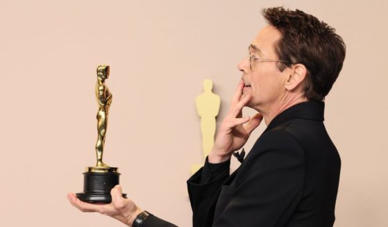 Robert Downey Jr. posing for pictures at the 96th Annual Academy Awards in Hollywood on March 10, 2024.