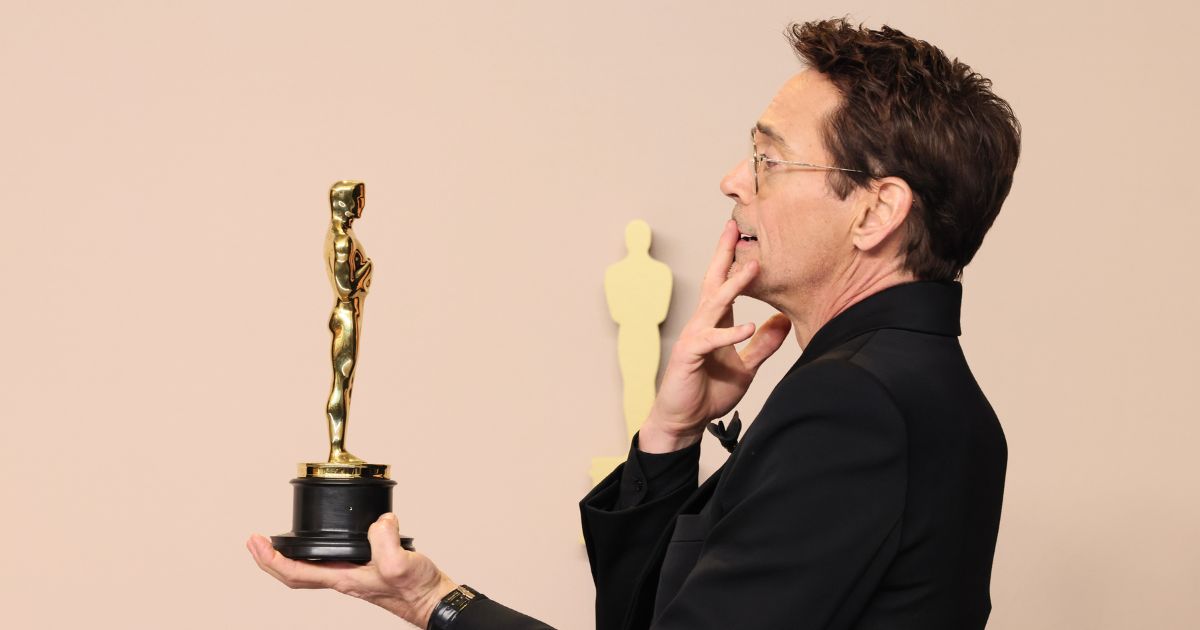 Robert Downey Jr. posing for pictures at the 96th Annual Academy Awards in Hollywood on March 10, 2024.