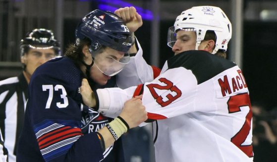Kurtis MacDermid of the New Jersey Devils fights with Matt Rempe of the New York Rangers at the start of a game at Madison Square Garden in New York City on Wednesday.