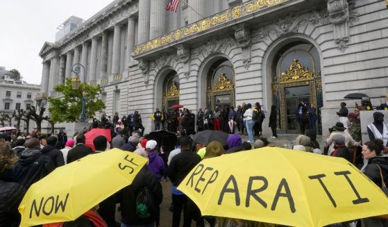 A crowd listens to speakers at a reparations rally outside of City Hall in San Francisco, in a file photo from March 14, 2023.