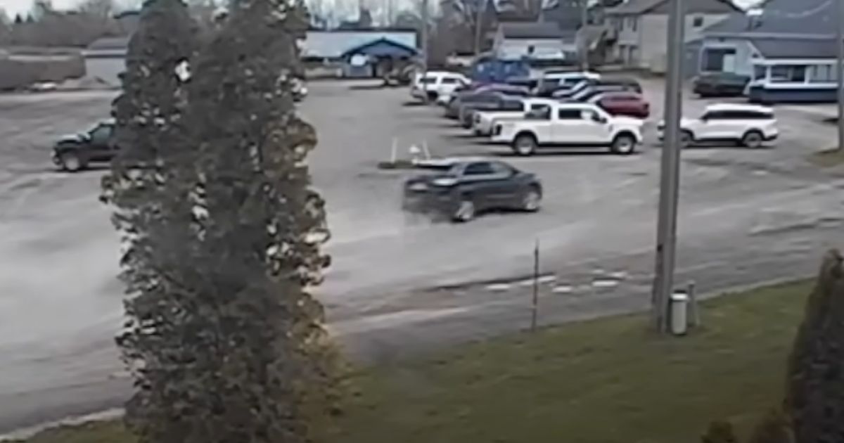 An SUV is seen racing toward a boat club in Michigan.