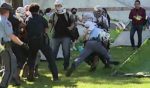 A Georgia State Patrol trooper tackles a pro-Palestine protester on the Emory University campus.