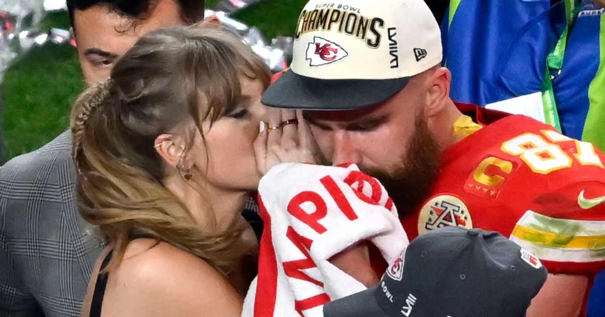 Pop star Taylor Swift, left, and Kansas City Chiefs tight end Travis Kelce, right, hare a moment after the NFL Super Bowl LVIII in Las Vegas, Nevada, on Feb. 11.