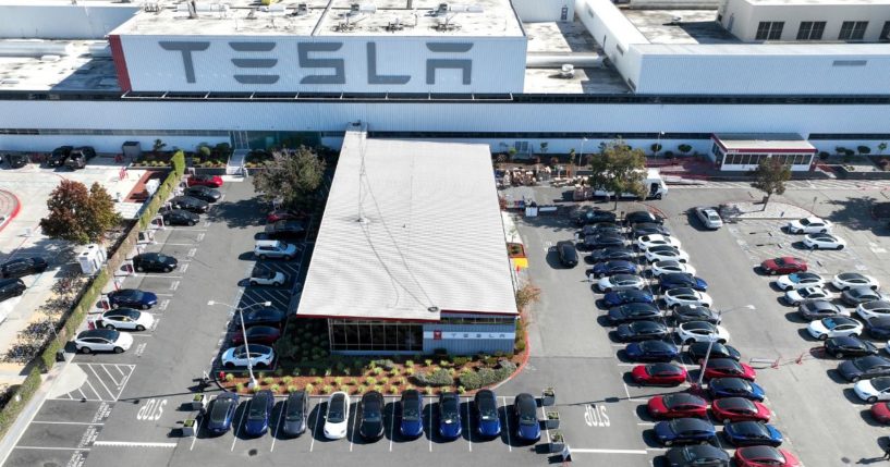 New Tesla cars sit in a parking lot at the Tesla factory in Fremont, California, on Oct. 19, 2022.